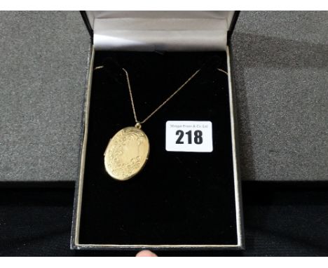 A 9ct Gold Locket And Chain