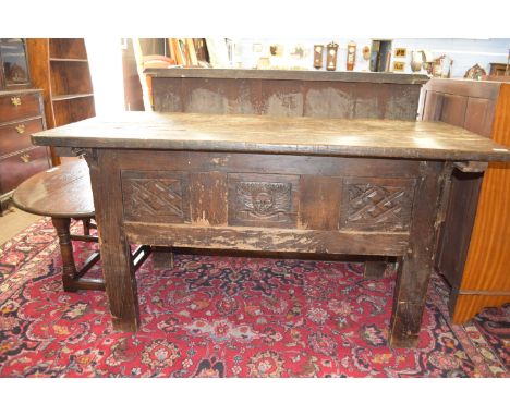 17th/18th century and later oak blanket box raised on stile legs with carved panel and planked top, approx 146 x 69cm max