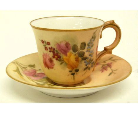 Miniature blush ground Royal Worcester cup and saucer, the blush ground decorated with flowers