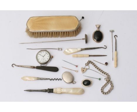 A collection of sewing tools, a silver watch, lockets and bracelets