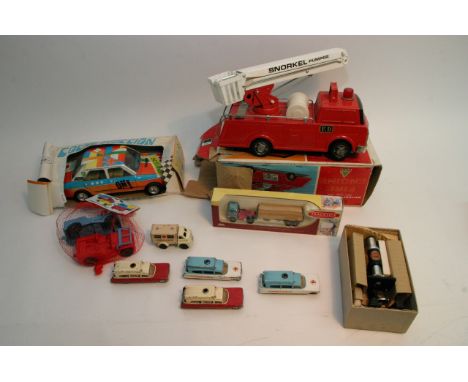 A box of toys consisting of tin plate fire engine, tin plate seat car and others