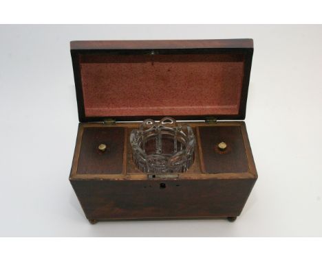 A George III mahogany tea caddy of sarcophagous shape