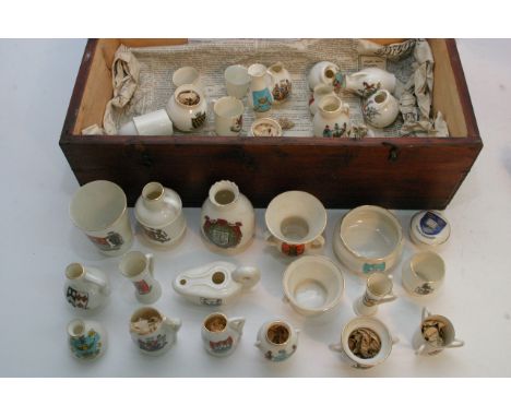 A box of crested ware items comprising many Goss examples.