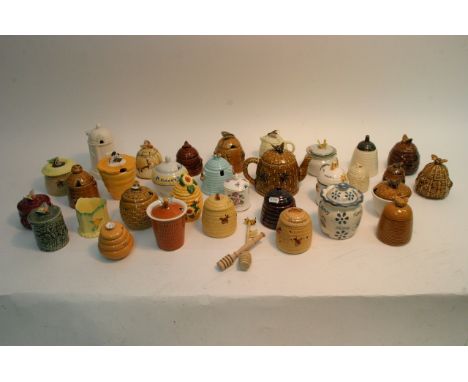 Two boxes of approximately 30 ceramic honey jars and preserve pots.