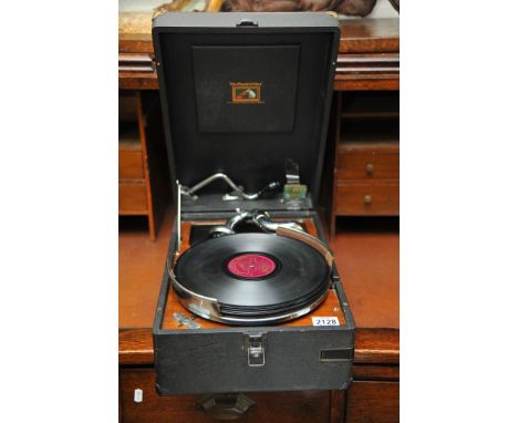 An HMV gramophone and records.