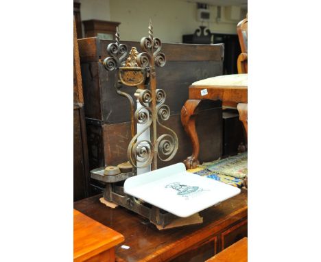A large set of enamel and metal shop beam balance scales 