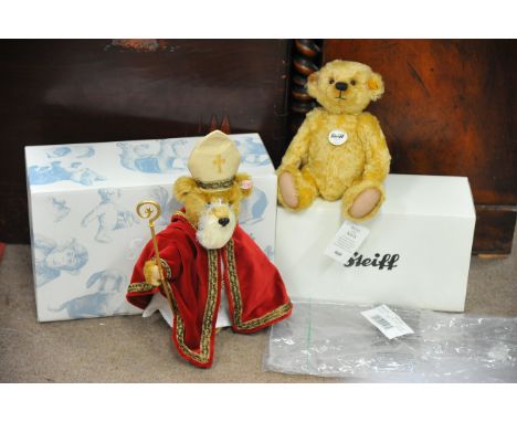 Two boxed Steiff bears comprising a small mohair blonde bear and a musical Saint Nicholas, complete with certificates.
