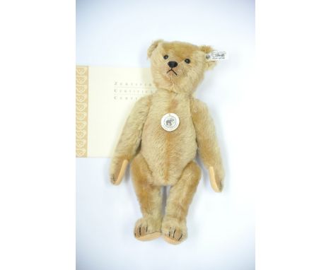 A modern Steiff bear fitted with growler and with certificate.