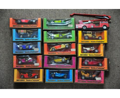 A box containing Yesteryear cars and a die cast fire engine.