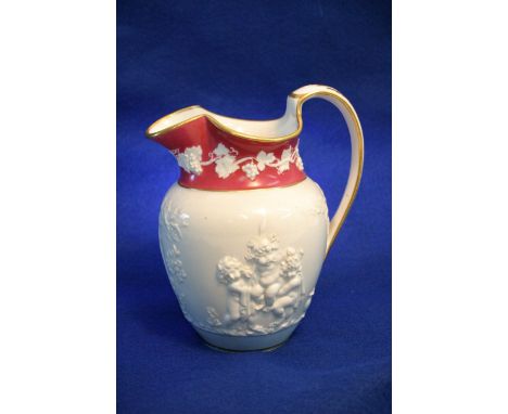 A 19th Spode jug decorated in relief with Bacchi, red painted mark to base