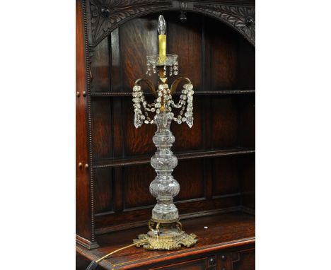 A large glass lamp with drop fittings on gilt metal base. Approximately 90cm