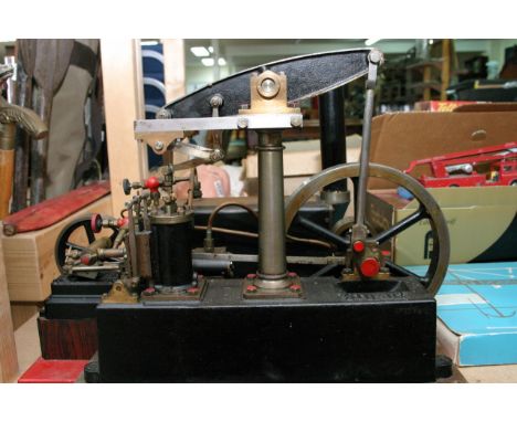 A single cylinder beam engine made by Stuart Turner, probably manufactured at Henley-On-Thames, probably during the 1950's