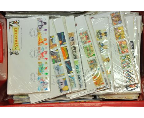 A box of first day covers and stamps.