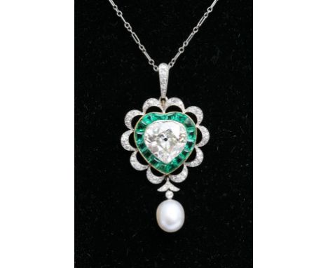 An Exceptional quality Edwardian pendent the centre set with a Heart shaped old cut diamond approx 3.5 carat weight flanked b