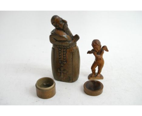 A cheeky wooden vesta of a monk, tiny wooden patch pot with a small carved cupid playing a flute
