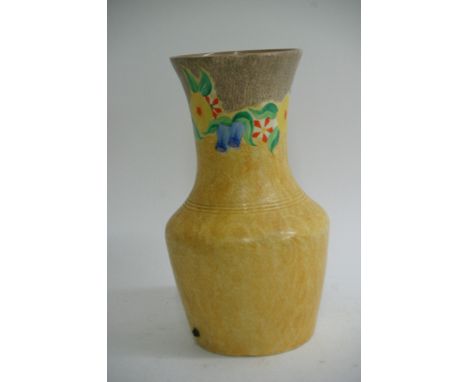 A Clarice Cliff yellow ground 'BIzzare' vase, the rim painted with petunias. Approximately 30cm, drilled to base