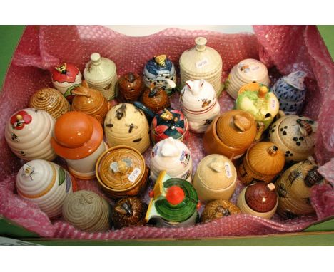 A box of approximately 30 ceramic honey jars and preserve pots.
