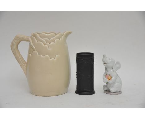 A Clarice Cliff white moulded jug, a Lladro model of an elephant and a Wedgwood black basalt vase
