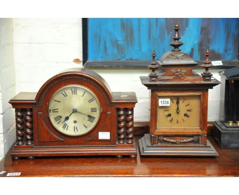 A mahogany cased eight day mantel clock and an oak mantel clock with barley twist decoration (2).