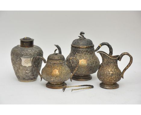 A four piece Chinese silver teaset  comprising teapot, jug, sucrier and caddy, all decorated in relief with palm leaves and e