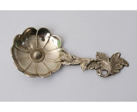 A Victorian silver caddy spoon shaped as a flower, Birmingham hallmarks. Approximately 8cm long