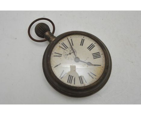 A large button wind clock the dial with subsidiary dial, 15cm diam.