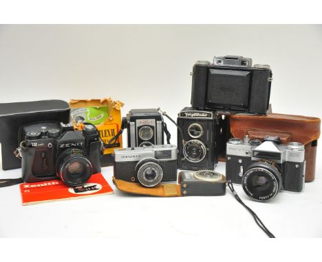 Two Zenith cameras, Kodak, small Olympus trip, Voightlander, light meter etc.