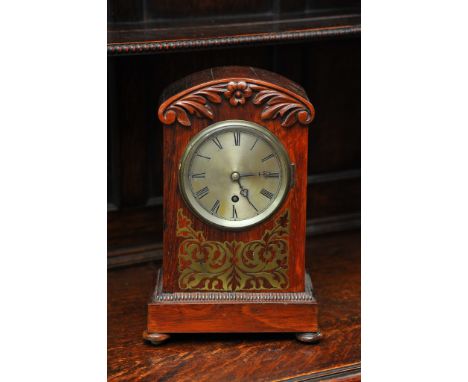 A rosewood mantel clock with brass inlaid decoration, approx height 29.5cm.
