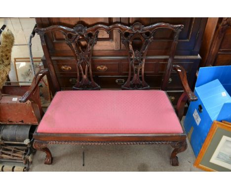 A Chippendale style two seat sofa.