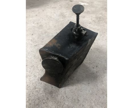 A vintage motorcycle oil tank with rare-to-find primer pump attached. 