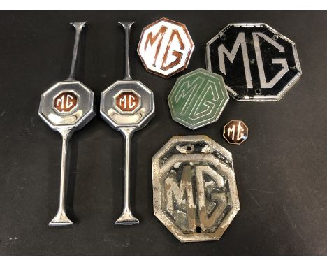 A selection of MG badges, headlamp bars etc.