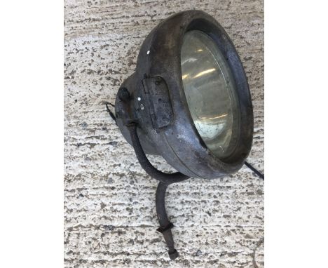 An extremely large stirrup mounted CAV model G bell-shaped headlamp.