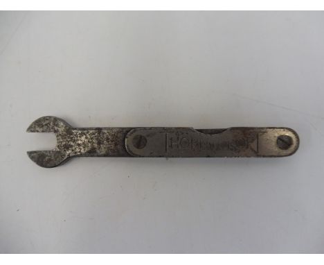 A Thornycroft spanner with integral feeler gauges. 
