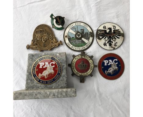 A quantity of Continental car badges including Belgium Royal Automobile Club.