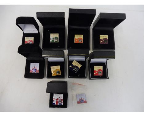 A box of London to Brighton Veteran Car Club enamel badges.
