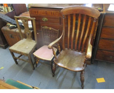 Four chairs to include a late 19th century elm seated Windsor lathe back chair, Georgian Chippendale style chair, and Edwardi
