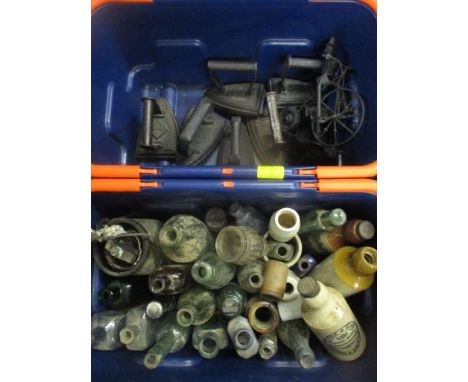 A mixed lot to include glass bottles, flat irons, storage box and stoneware bottles, some advertising examples including E Co