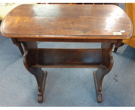 An oak table with integral book trough below, 74cm h x 69cm w x 33cm d, having carved side supportsLocation: A3M 