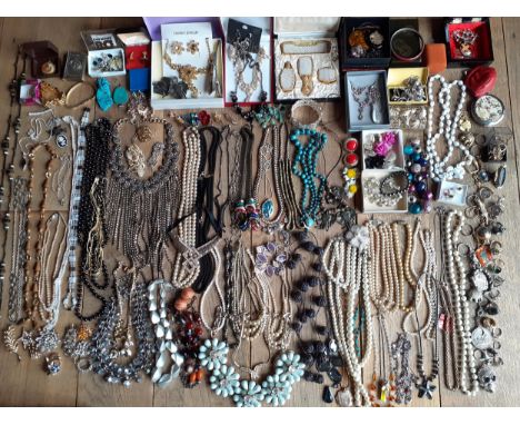 A large quantity of vintage to modern day costume jewellery to include enamelled brooches, strings of pearls to include silve