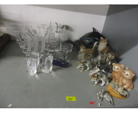 Glass and ceramics to include a set of three Poole model dolphins, glass model boats by G Durand, a lamp, a tankard and other