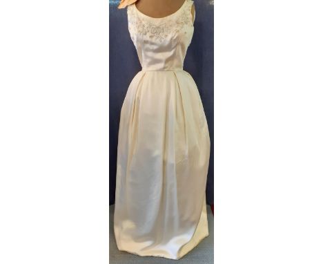 A vintage cream silk and handmade gown, possibly adapted from a wedding gown, having a bead and sequin neckline, 36" chest x 