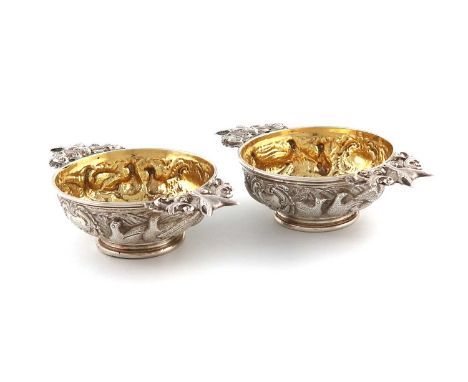 A pair of William IV Scottish silver quaiches,by Elder &amp; Co, Edinburgh 1831,circular form, embossed and chased with game 