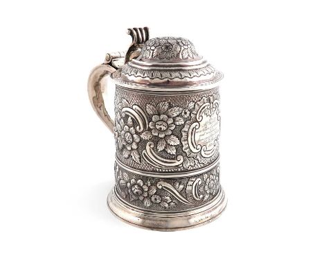 A George I silver tankard,by William Spackman, London 1725,tapering circular form, later foliate scroll decoration, domed hin