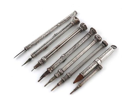 A collection of eight Victorian and later pencils,various makers,comprising: a combination pen and pencil, engine-turned deco