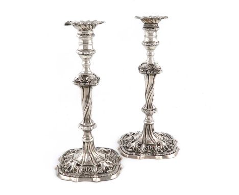 A pair of George III silver candlesticks, by Ebenezer Coker, London 1771,knopped twisted stems, with gadroon borders and leaf