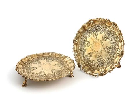 A pair of George II Irish silver-gilt waiters,by William Townsend, Dublin circa 1745,circular form, scroll and shell border, 