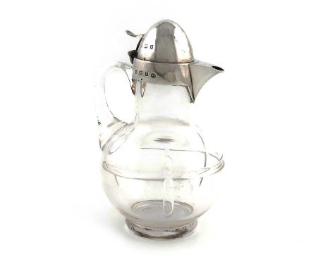 A late-Victorian silver-mounted glass liquor decanter,by Heath and Middleton, Birmingham 1897,baluster form, scroll handle, d