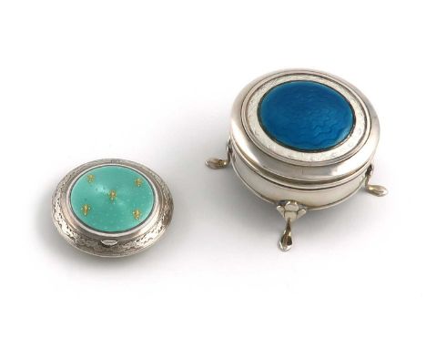 A silver and enamel dressing table box,by Cohen and Charles, Birmingham 1911,circular form, the hinged cover with blue and wh