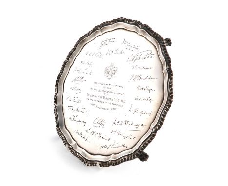 A presentation silver salver,by Stevenson &amp; Law, Sheffield 1937,circular form, gadroon border, the centre with a presenta