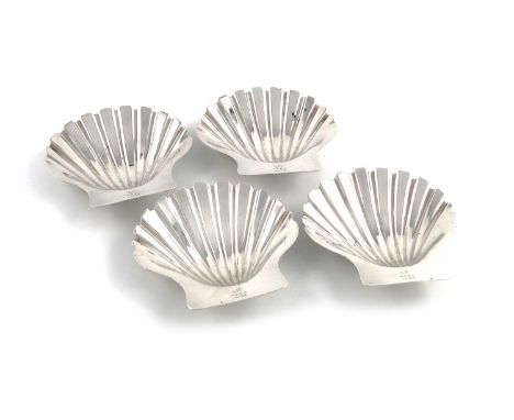 A set of four Victorian silver butter shells,by Robert Garrard, London 1822,plain shell form, on two winkle feet, engraved wi